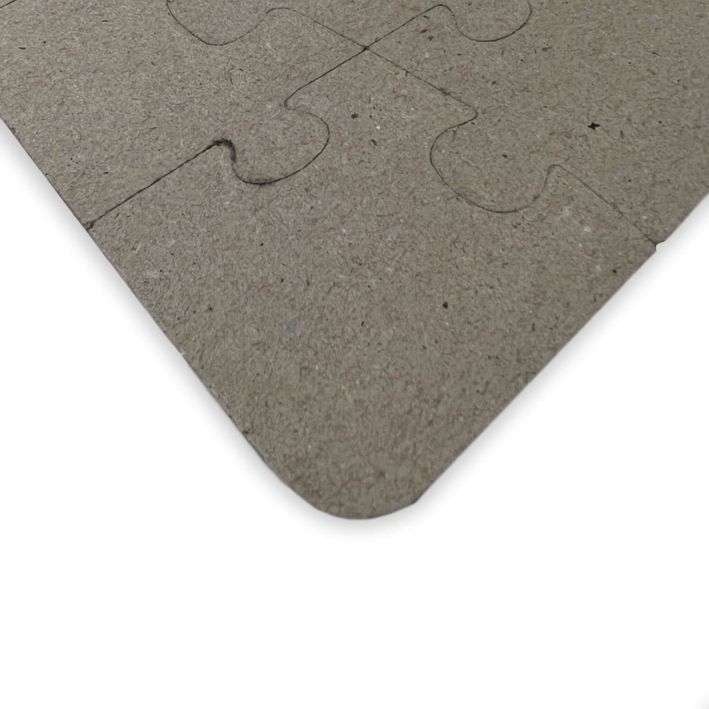 Eco-friendly puzzle piece close-up, showing textured surface and rounded edges, perfect for underwater learning fun.