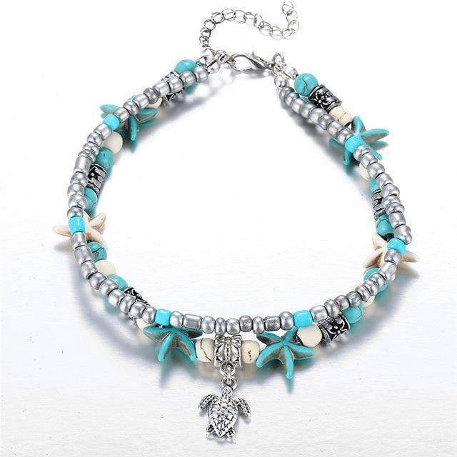 Ocean theme double layer anklet with turtle charm and beach-inspired beads in blue and silver.