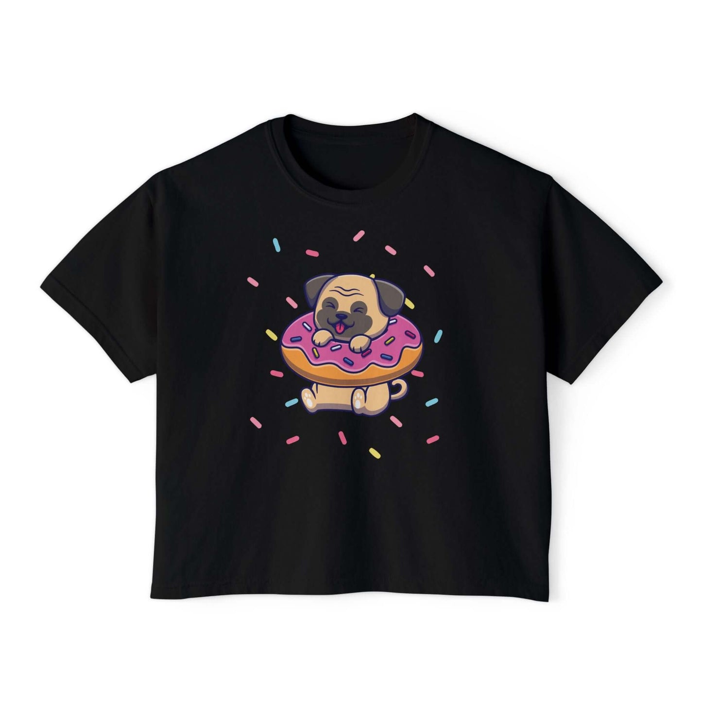 Playful pug on a donut with sprinkles, featured on a boxy black women’s tee shirt, perfect for dog lovers.
