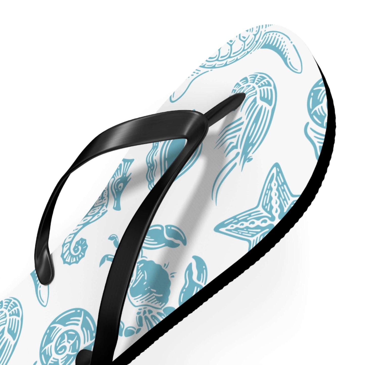 Close-up of Turtle Beachy Flip Flops with nautical shell print, perfect for summer beach vibes.