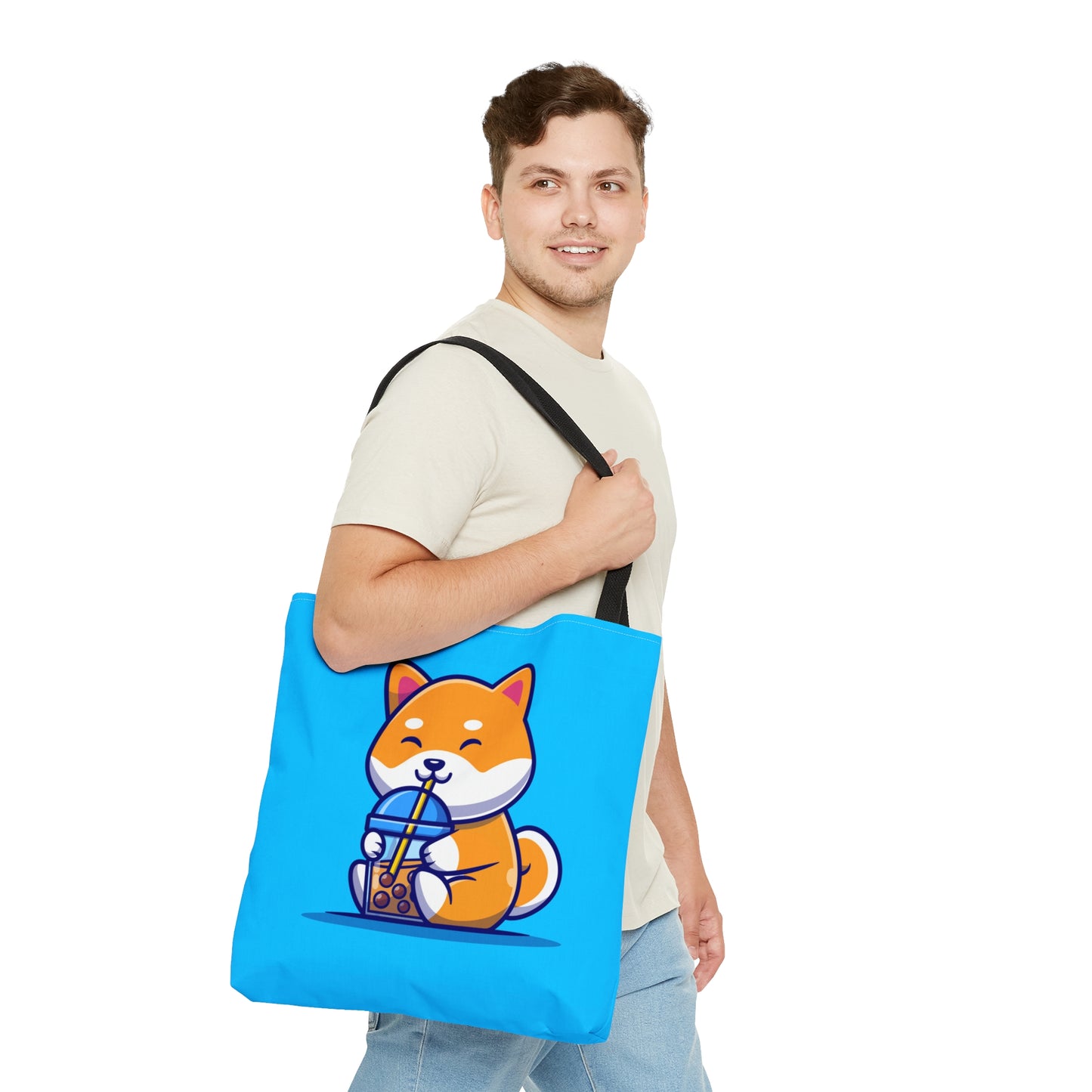 Man walking with Turquoise Bag with black Handles with orange shiba Inu sitting and drinking boba hanging on his shoulder 