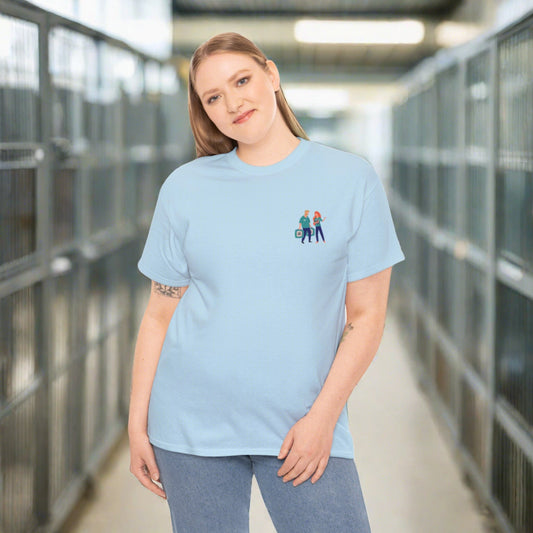 White woman with blonde hair wearing a light blue t-shirt with a chest pocket image of two animal shelter workers. 