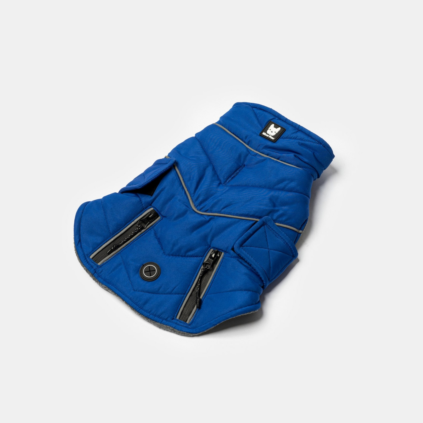 Blue Monty Jacket laid out showing top of jacket and two zippers