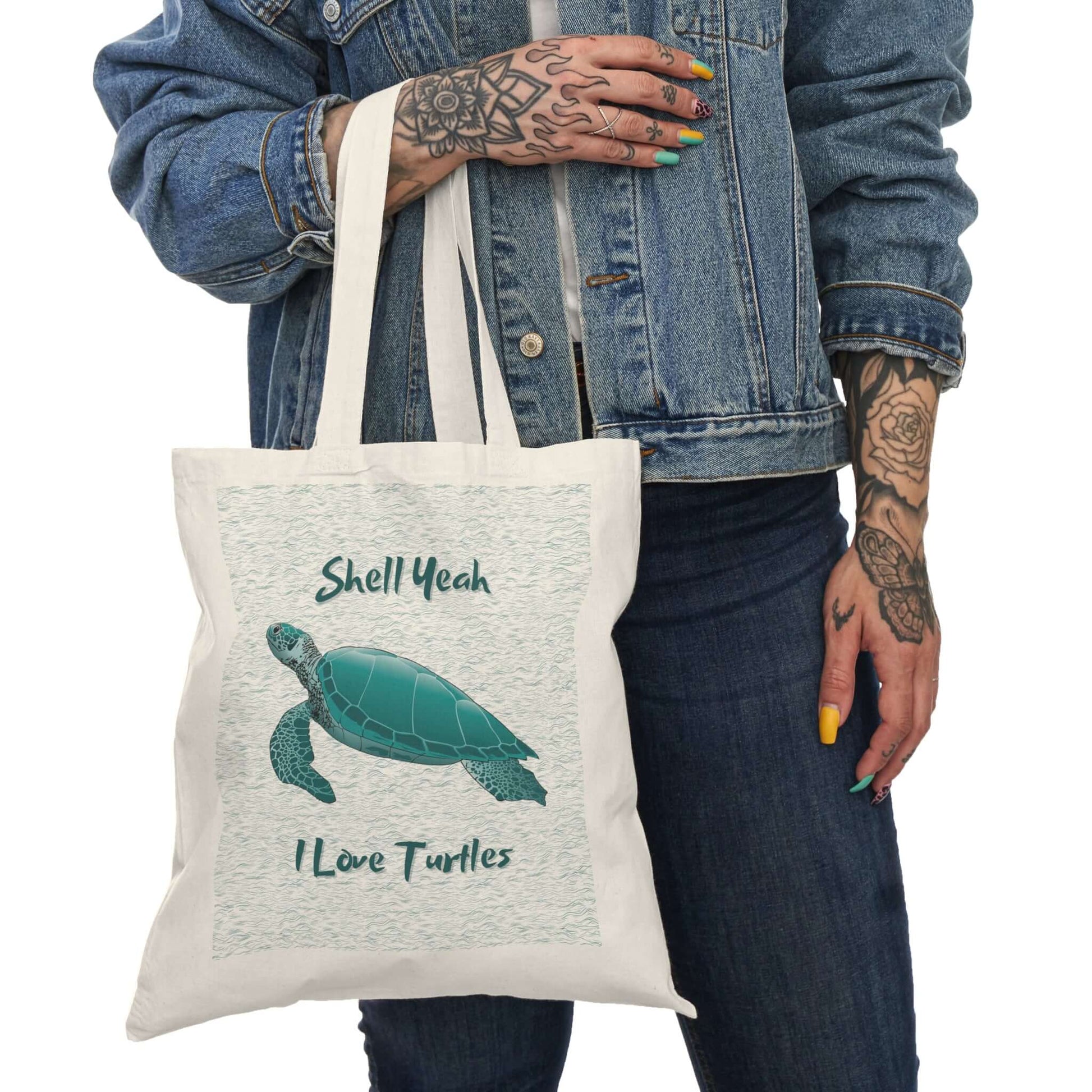 Eco-friendly turtle tote bag with 'Shell Yeah, I Love Turtles' phrase, perfect for beach outings.