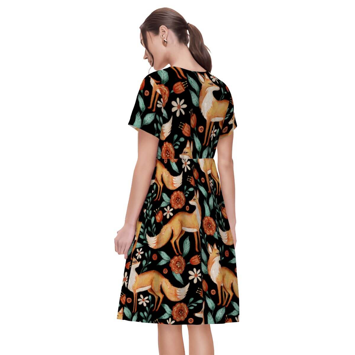 Black women's t-shirt dress with floral and red foxes pattern, showcasing a relaxed fit and witchy vibe.