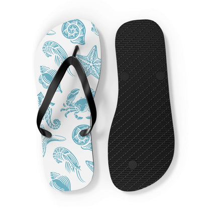 Turtle Beachy Flip Flops with ocean shell print, black straps, and non-slip sole for summer adventures.